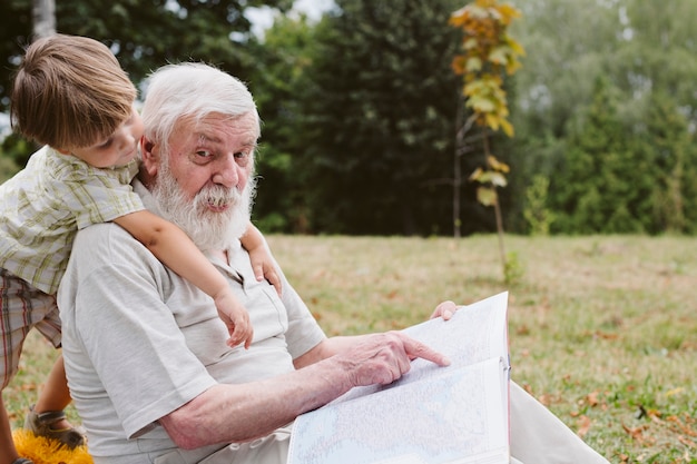 grandpa-grandson-park-story-time_23-2148294885.jpg