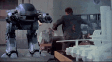 ed-209-shoots-kinney.gif
