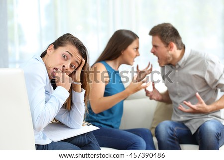 stock-photo-couple-arguing-and-breaking-up-in-a-marriage-counseling-and-driving-crazy-to-the-therapist-in-a-457390486.jpg