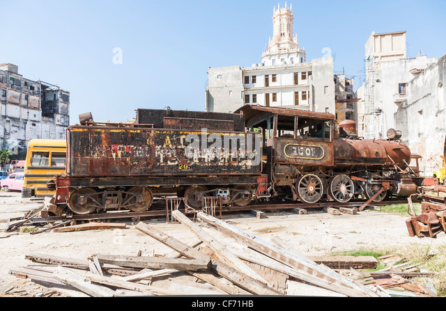 old-broken-down-steam-train-engine-and-tender-being-restored-in-a-cf71hb.jpg
