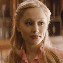 a close up of a woman 's face with blonde hair