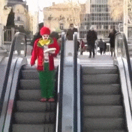 clown-pies-face-escalator-prank-14170396812.gif