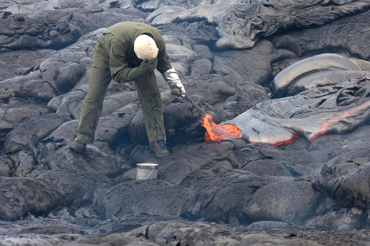 Sampling_lava_with_hammer_and_bucket.jpg