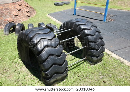 stock-photo-tire-climbing-at-an-empty-children-s-playground-20310346.jpg