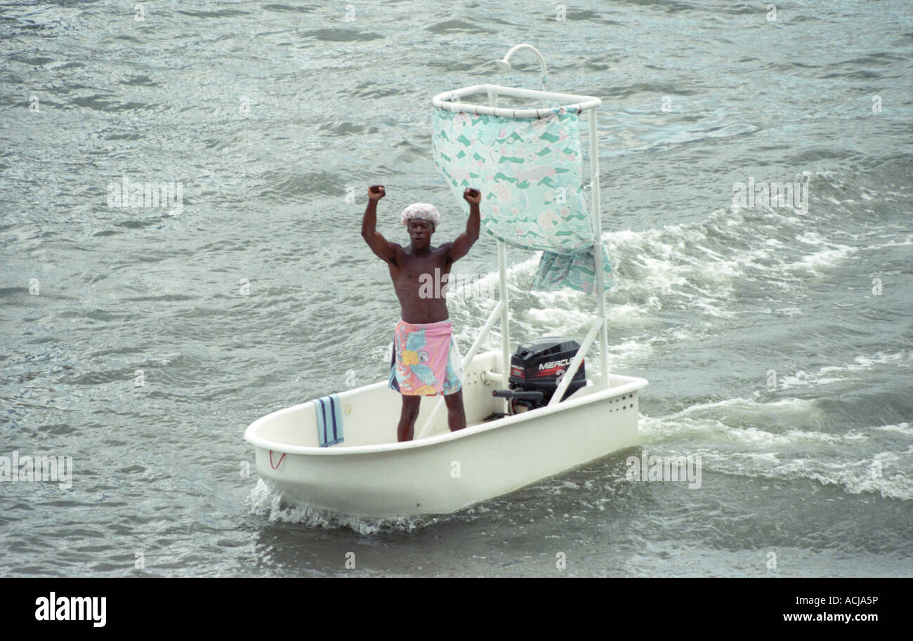 man-in-a-bathtub-boat-with-outboard-motor-ACJA5P.jpg