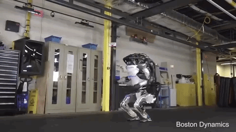 boston-dynamics-robot-doing-a-twist-in-the-air-and-a-gymnastics-finish-gif