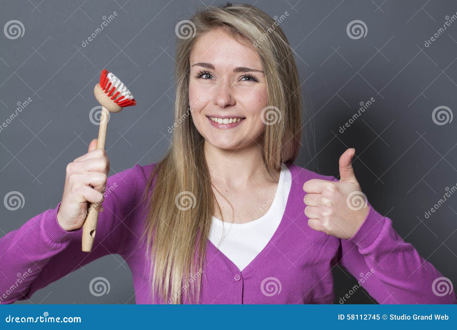 thrilled-s-girl-agreeing-cleaning-dishes-house-cleaning-playful-young-blond-woman-wearing-purple-sweater-holding-dish-58112745.jpg